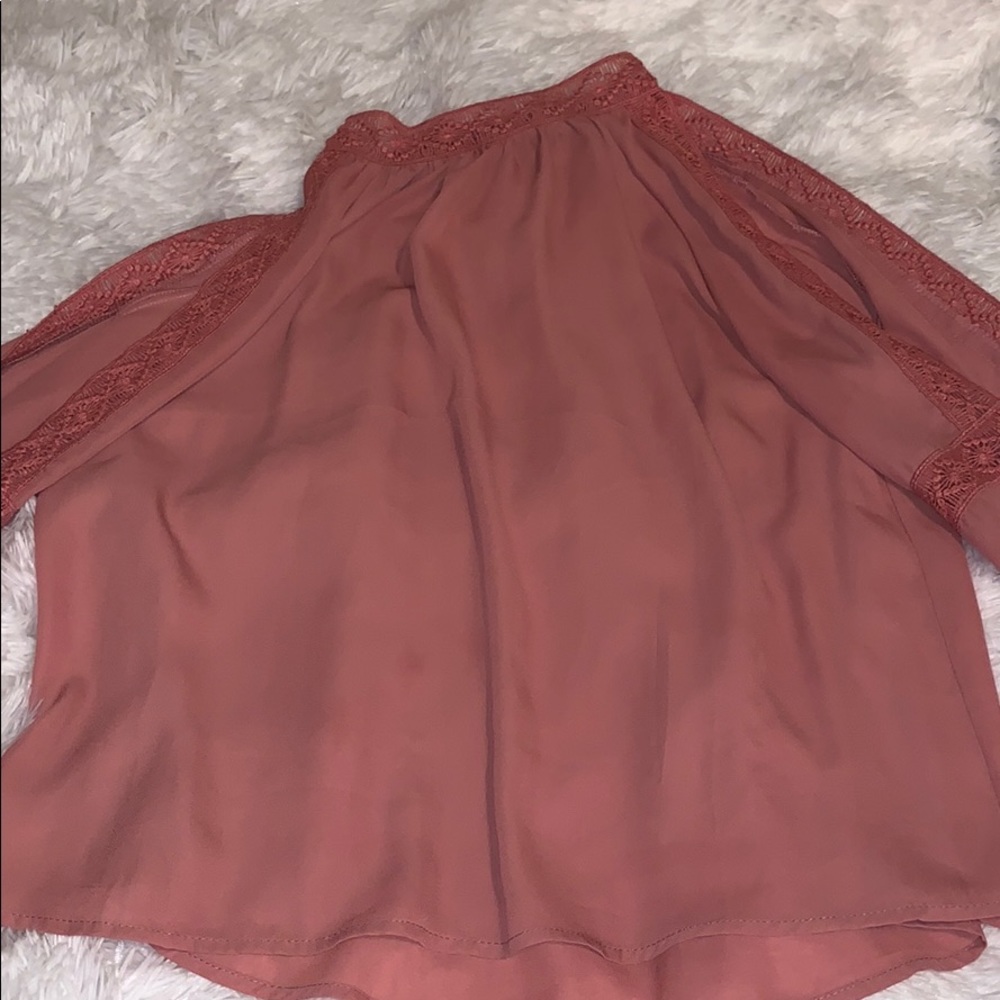 A long sleeve open shoulder shirt.